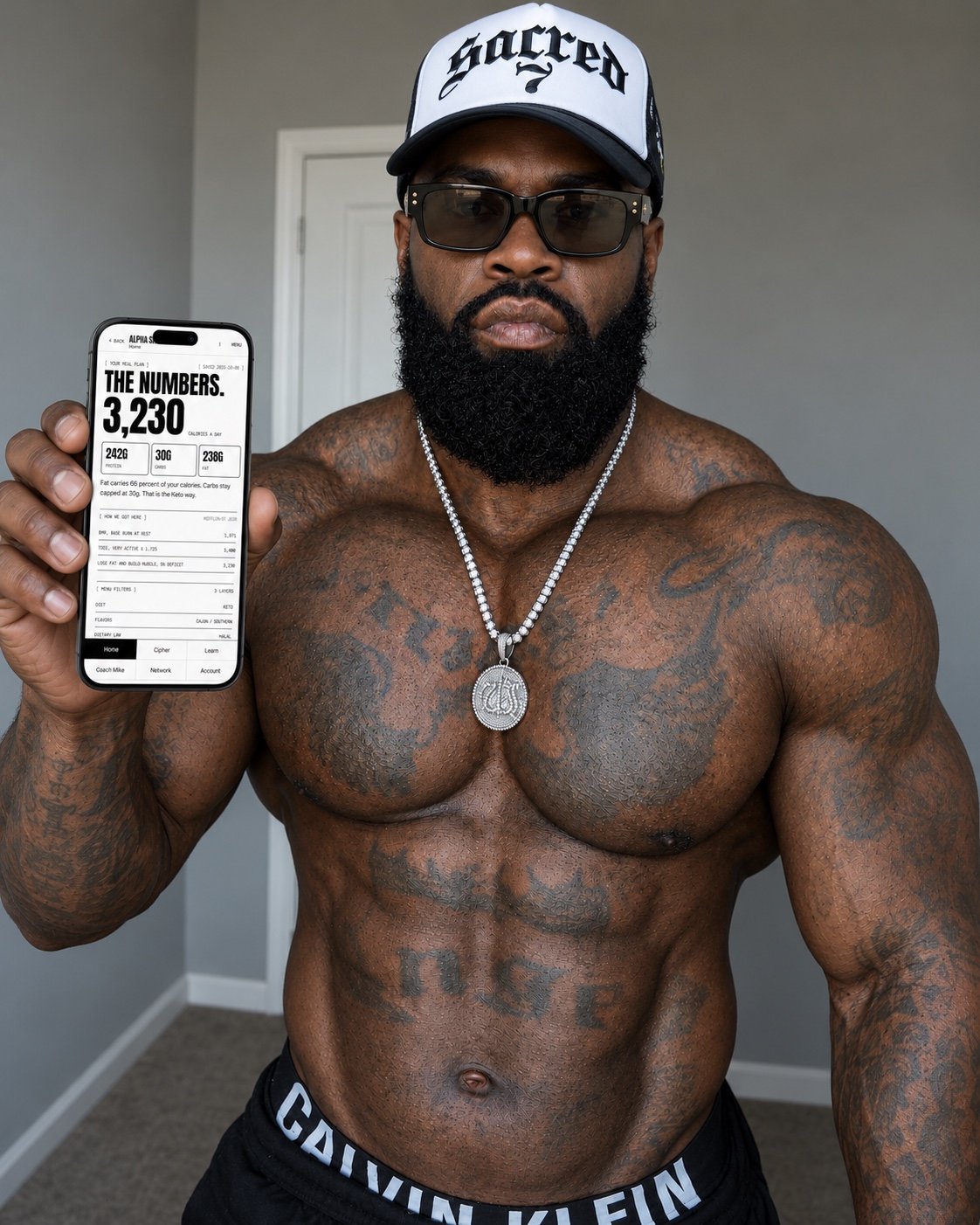 Mike Rashid holding his phone toward the camera to show the Alpha Shred nutrition dashboard.
